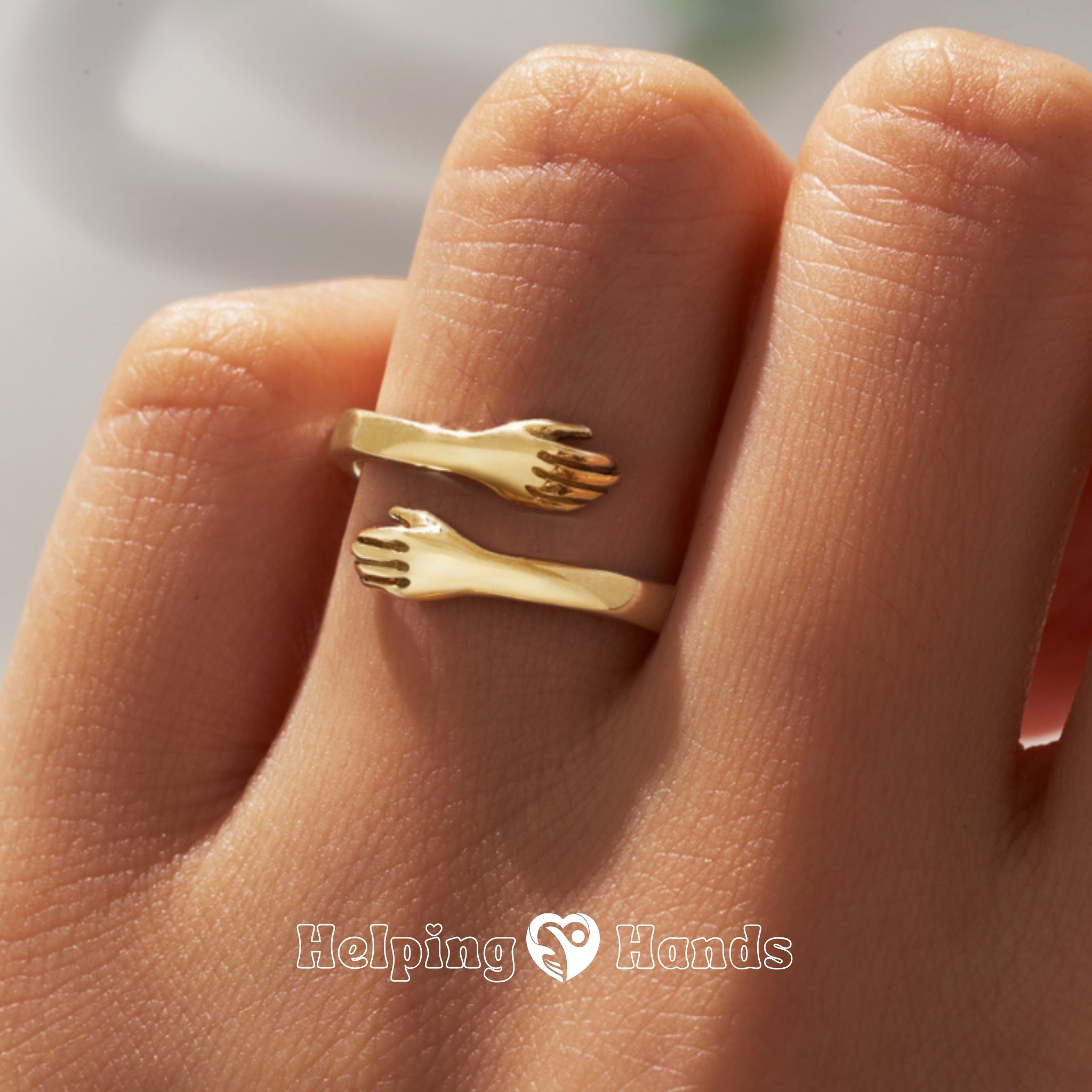 Artistic Gold ring with hugging hands


