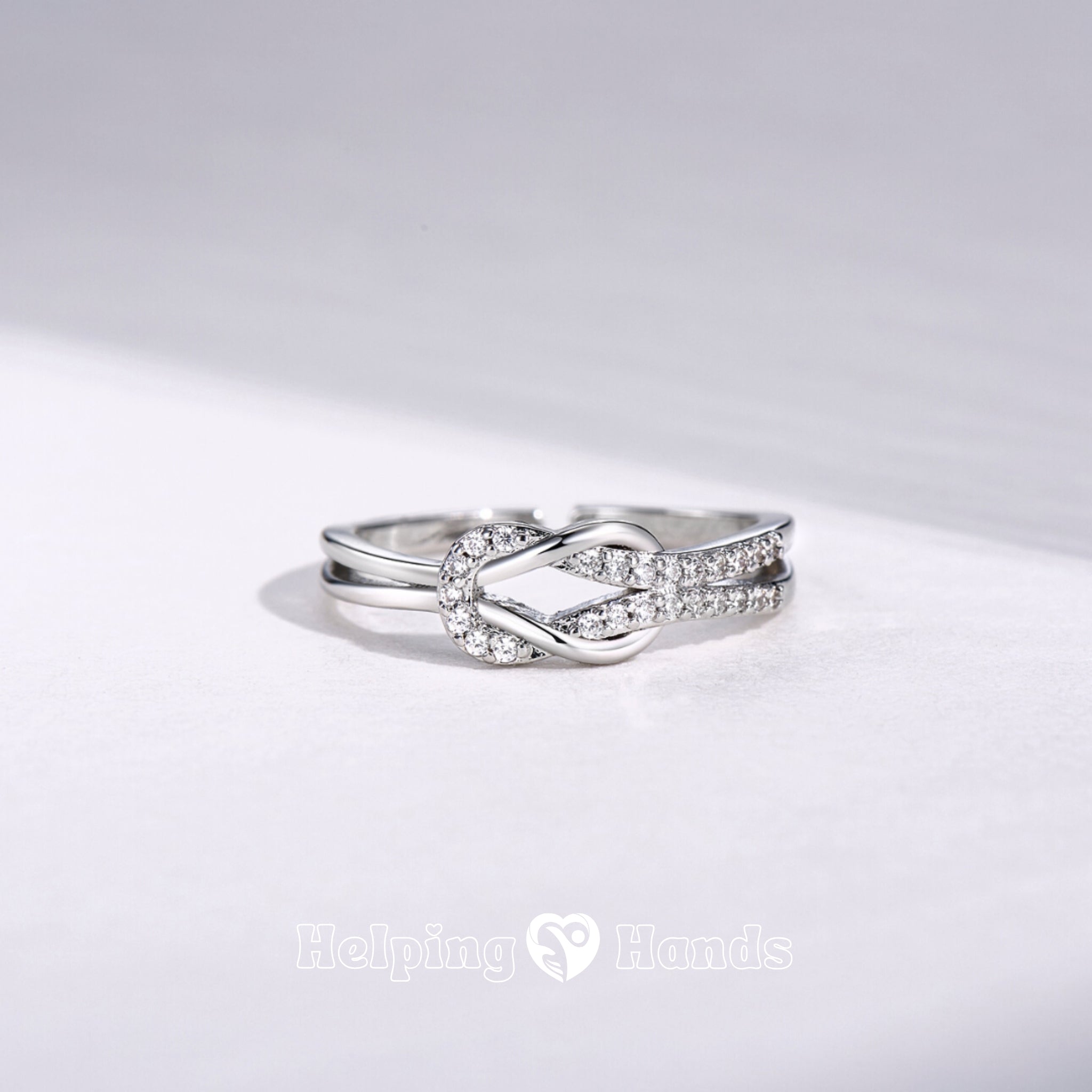 Dainty diamond-studded knot ring


