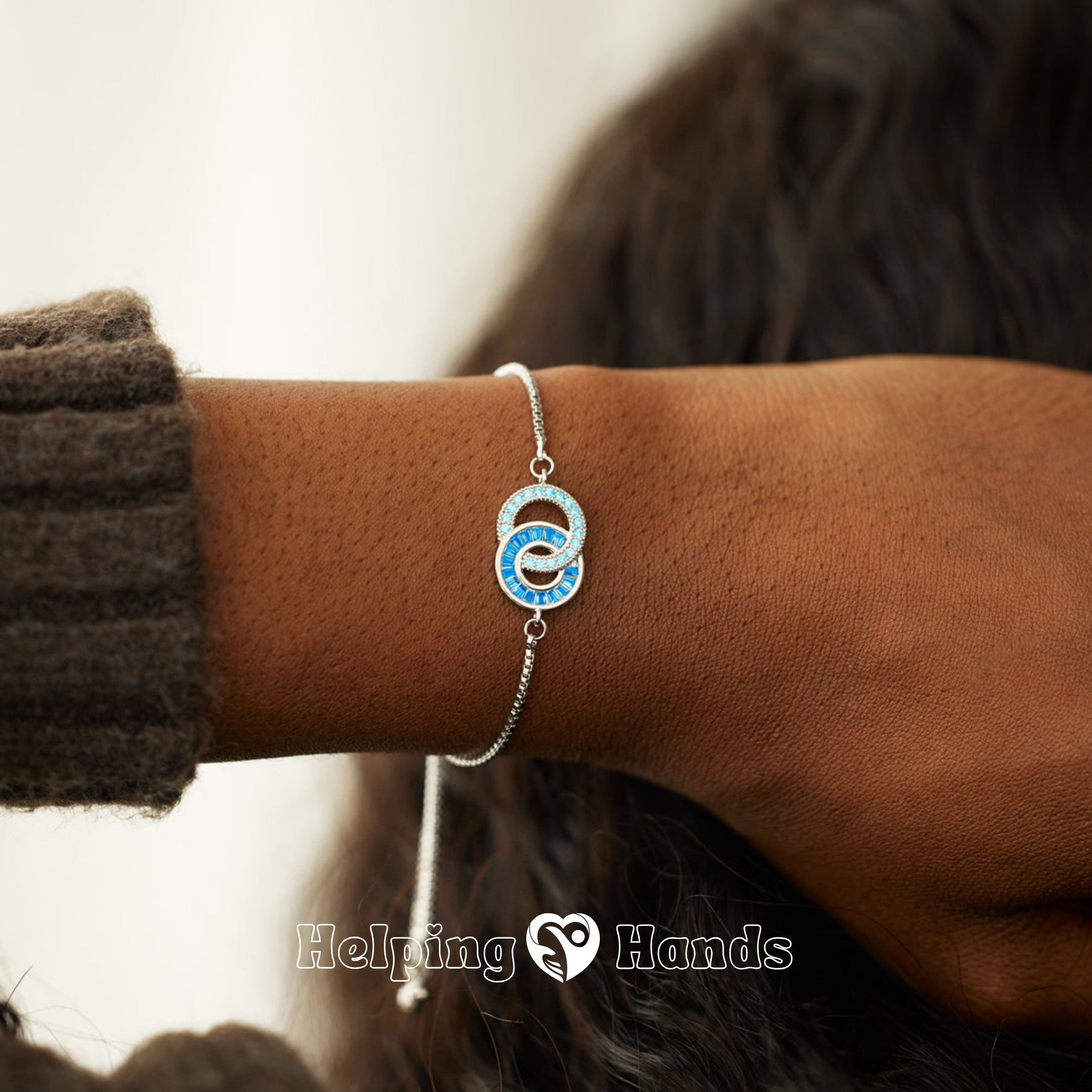 Linked circle charm bracelet with shimmering stones

