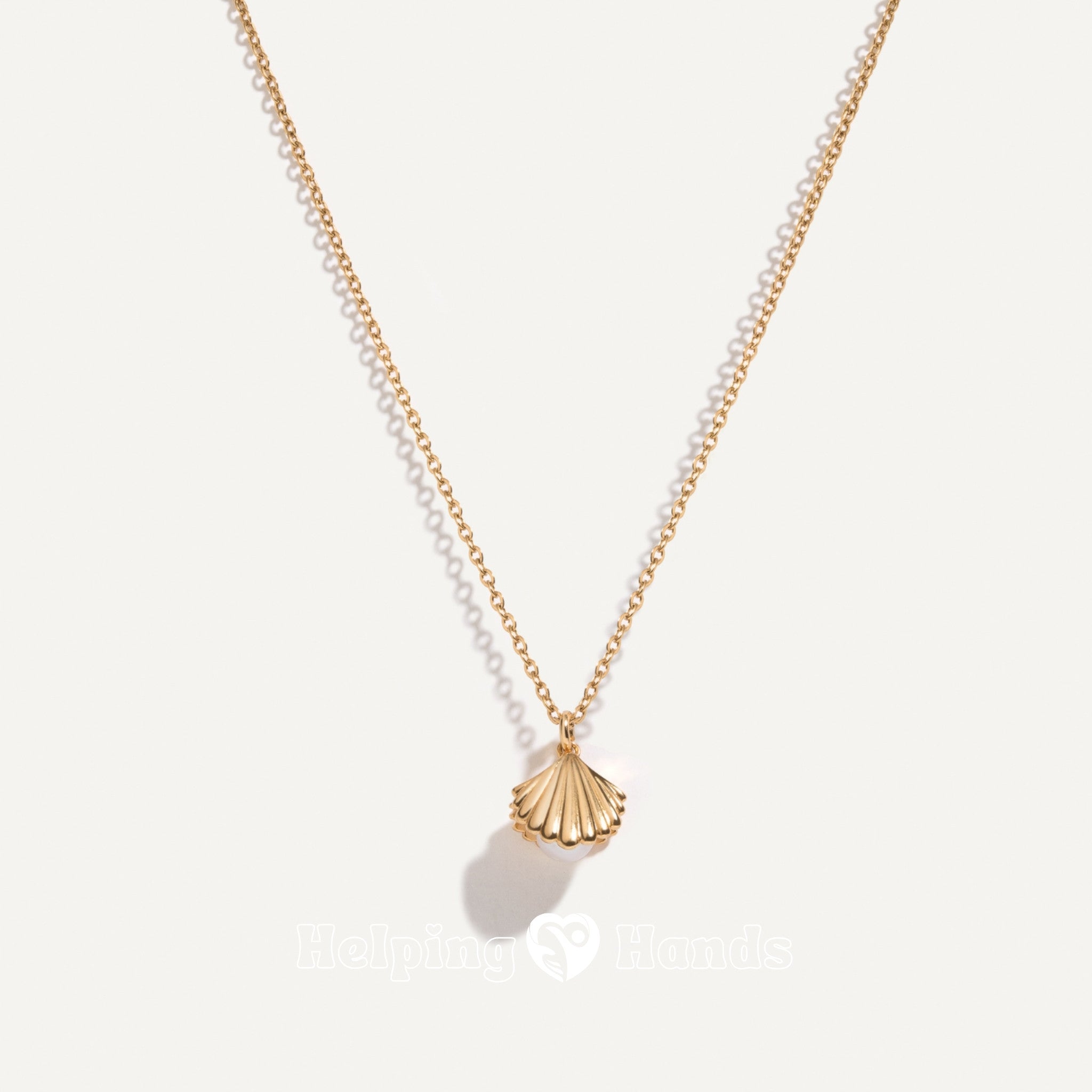 Clamshell locket necklace with white pearl charm

