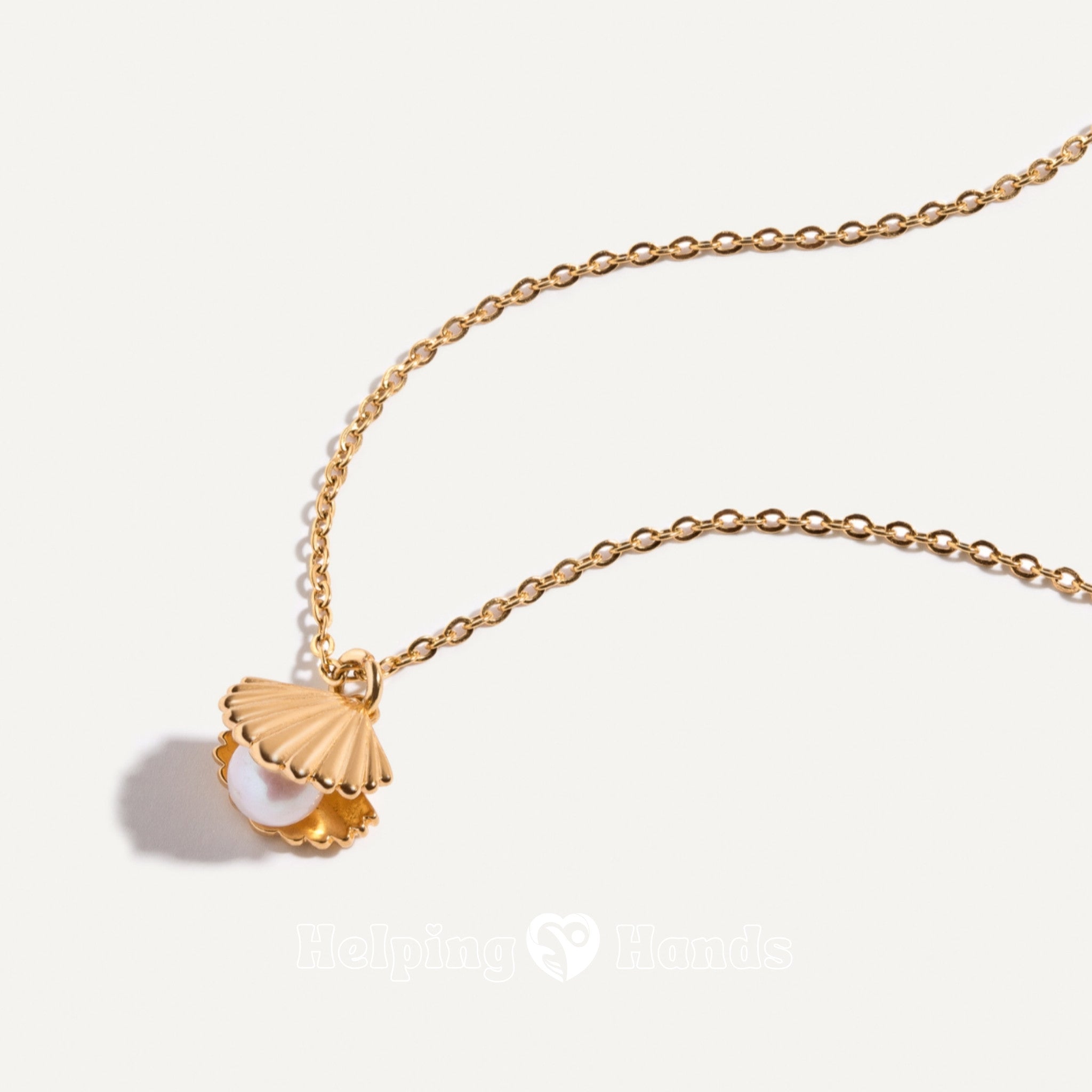 Gold seashell pendant necklace with pearl inside

