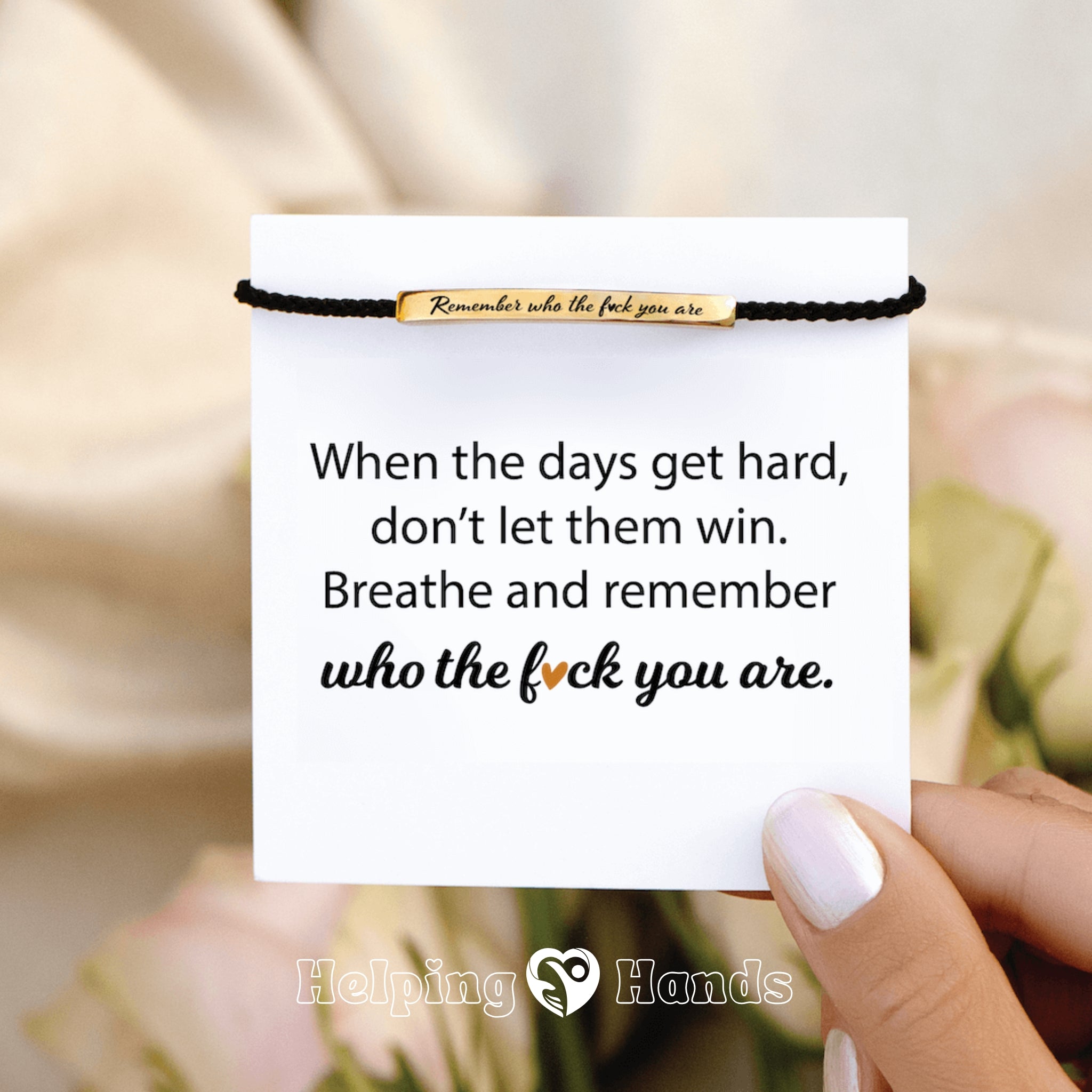 Empowering gold bar bracelet with black braided band and strong message

