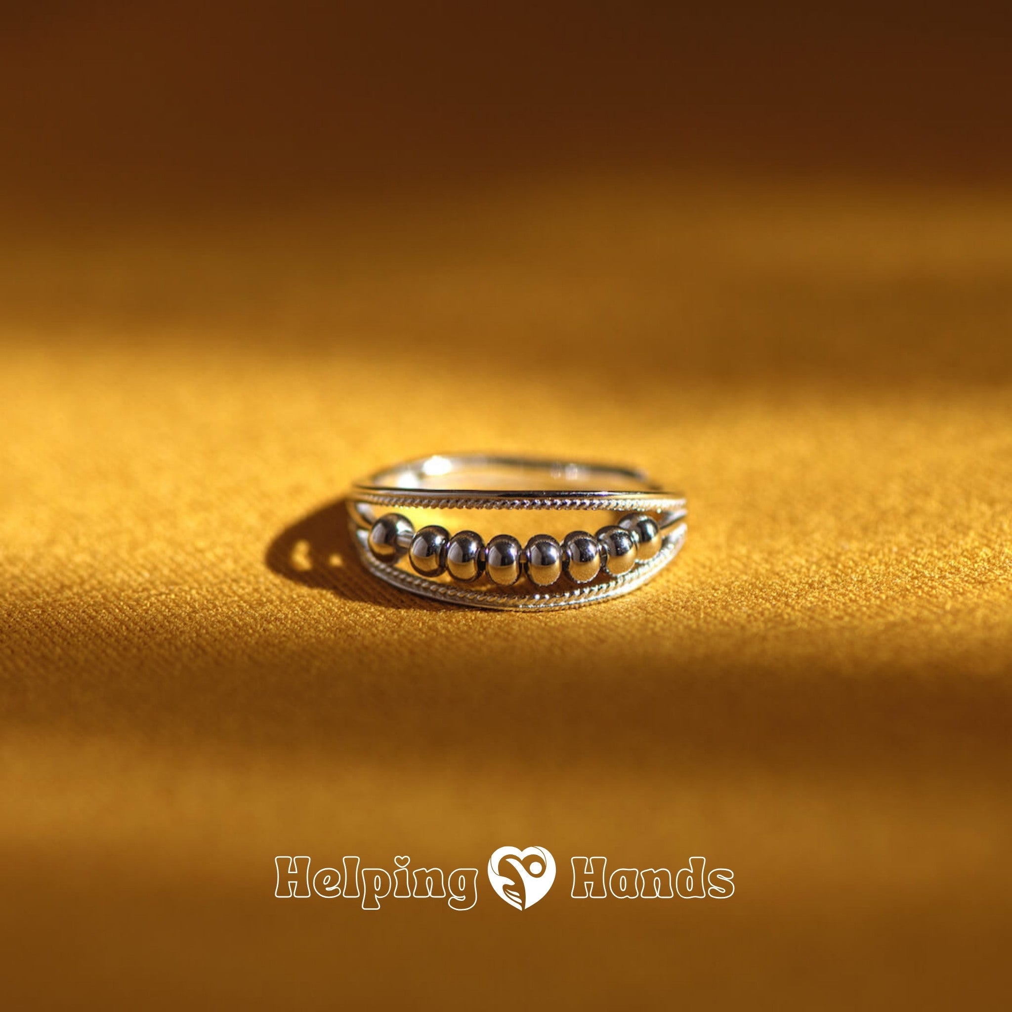 Adjustable silver ring with central sphere accents

