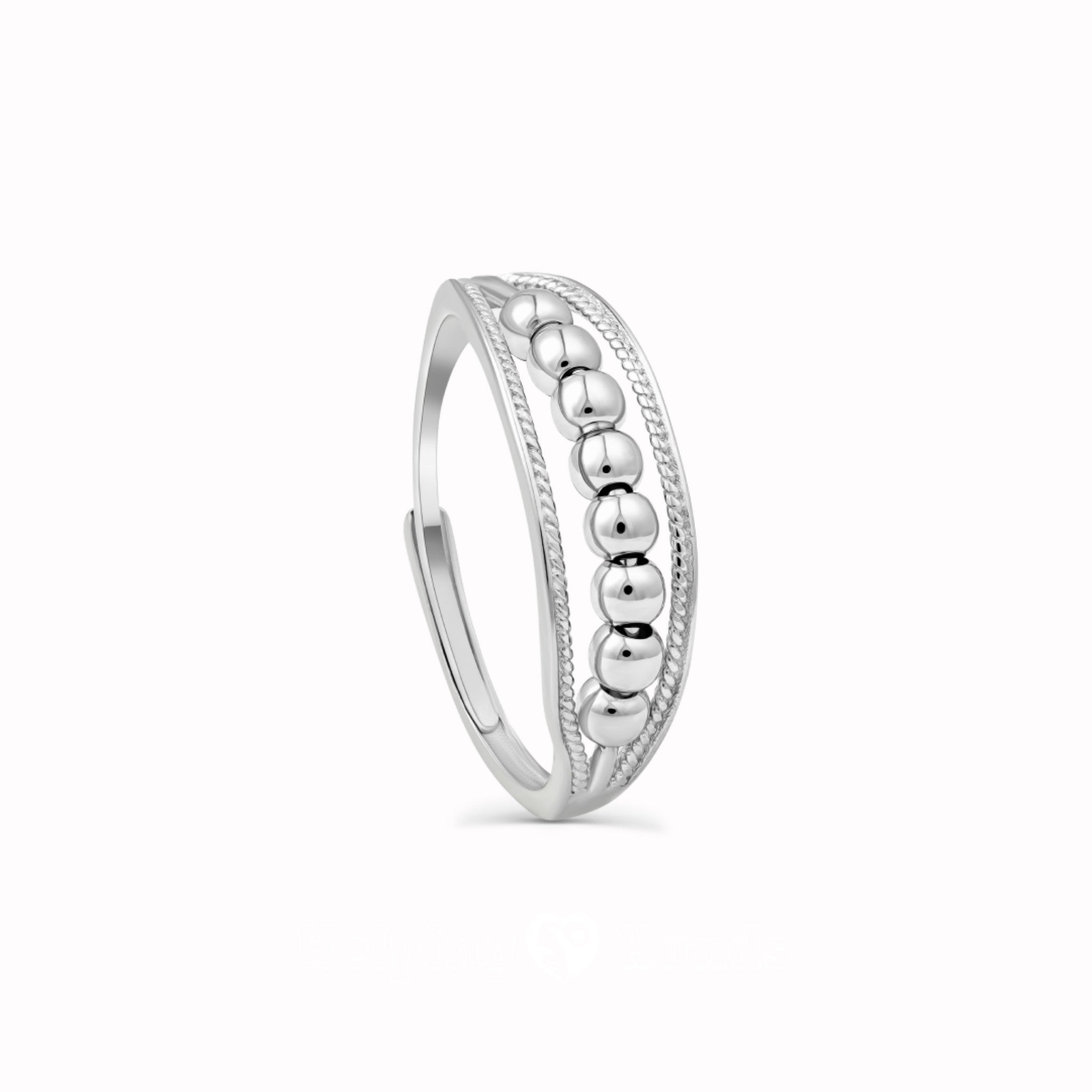 Silver ring with beaded center design

