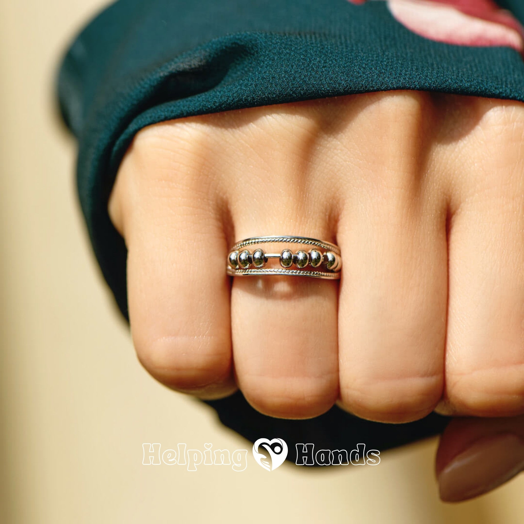 Minimalist silver bead ring on finger

