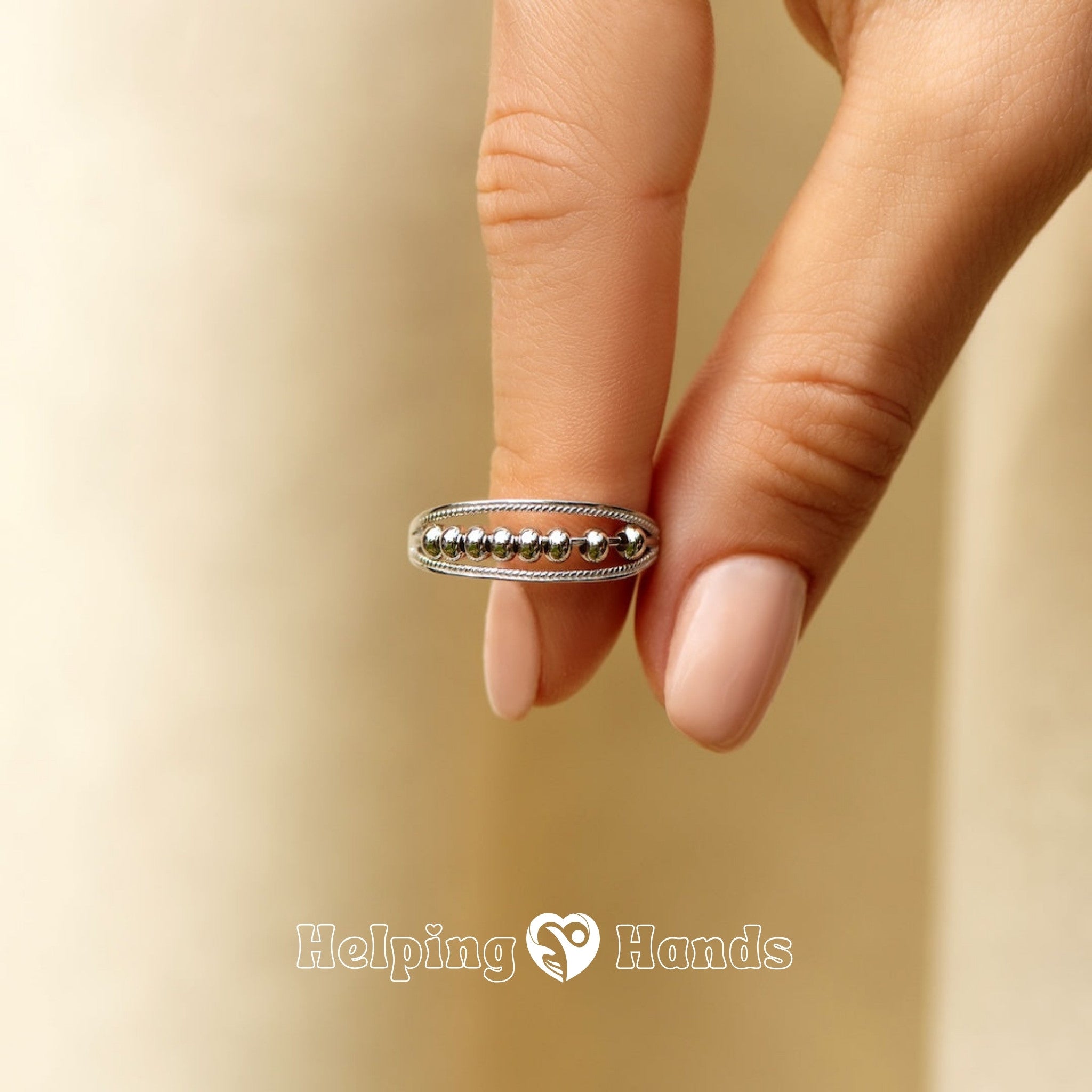 silver beaded ring with delicate rope-edge detailing for a timeless look.

