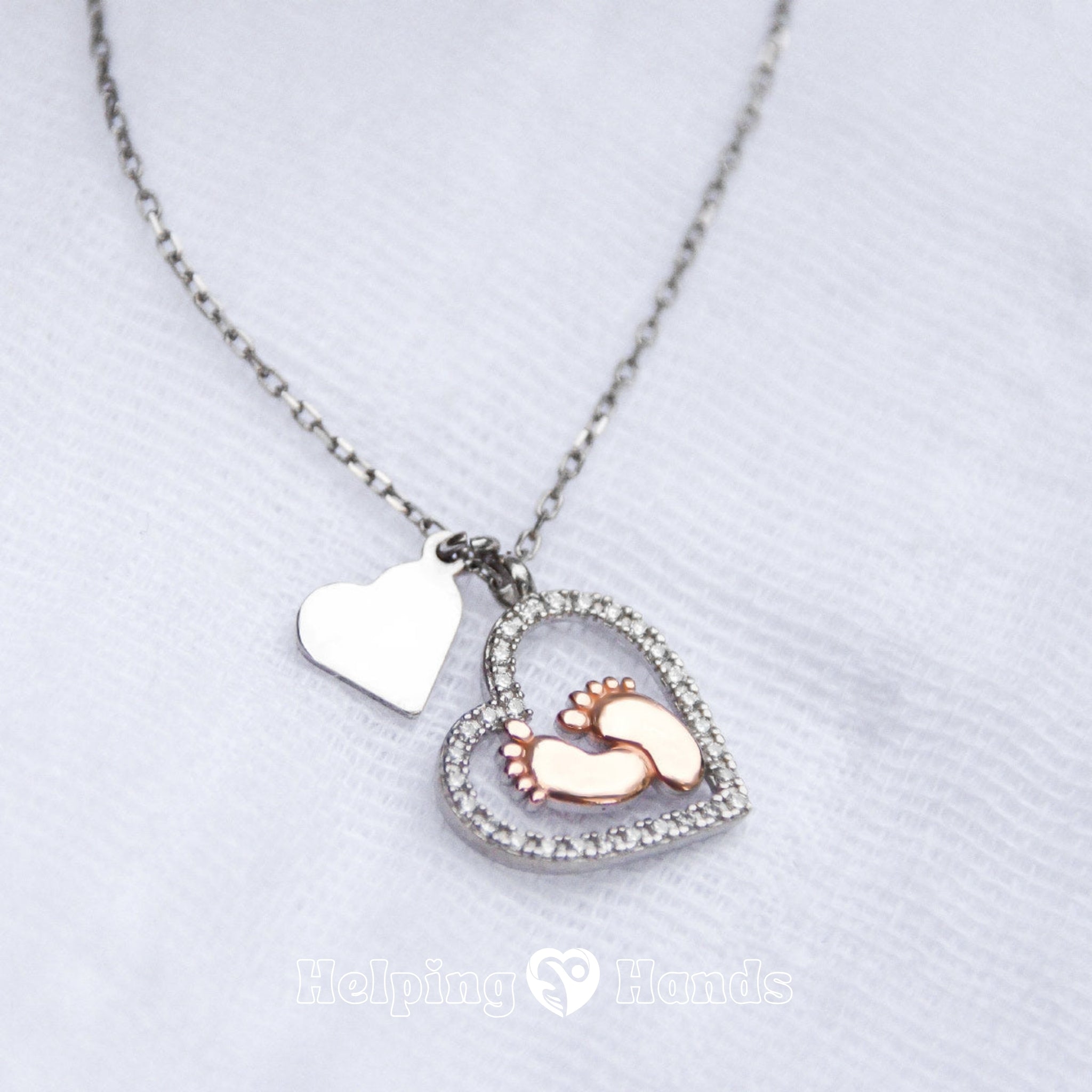 Sparkling heart necklace with rose gold baby feet and loving pregnancy message card for mums-to-be.

